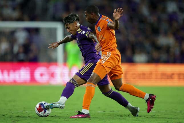 Mar 4, 2023; Orlando, Florida, USA; Orlando City SC forward Facundo Torres (17) controls the ball from FC Cincinnati defender Ray Gaddis (28) in the second half at Exploria Stadium.