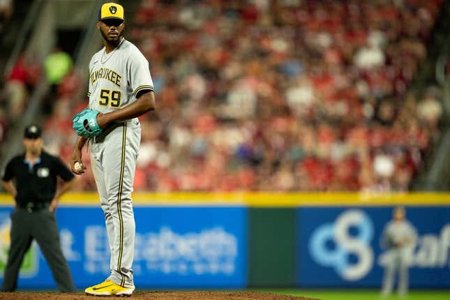 Milwaukee Brewers relief pitcher Elvis Peguero (59) prepares to pitch in the seventh inning of the MLB baseball game between the Cincinnati Reds and the Milwaukee Brewers at Great American Ball Park in Cincinnati on Saturday, July 15, 2023.