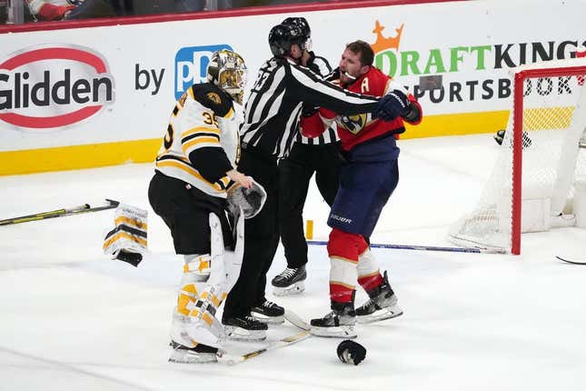 Apr 23, 2023; Sunrise, Florida, USA; Florida Panthers left wing Matthew Tkachuk (19) and Boston Bruins goaltender Linus Ullmark (35) are separated by the linesmen after a line brawl during the third period of game four in the first round of the 2023 Stanley Cup Playoffs at FLA Live Arena.