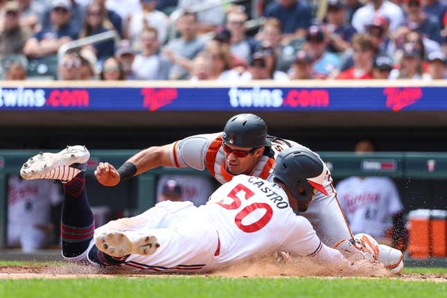 May 24, 2023; Minneapolis, Minnesota, USA; Minnesota Twins left fielder Willi Castro (50) steals home against San Francisco Giants catcher Blake Sabol (2) during the third inning at Target Field.