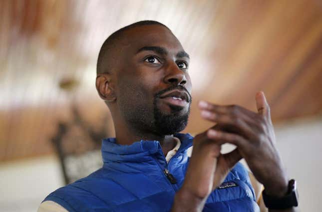 In this March 26, 2016, file photo, Black Lives Matter activist DeRay Mckesson chats with campaign volunteers in Baltimore.