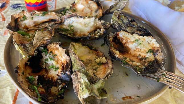 Image for article titled Charbroil Buttery, Garlicky Oysters Over Your Charcoal Chimney