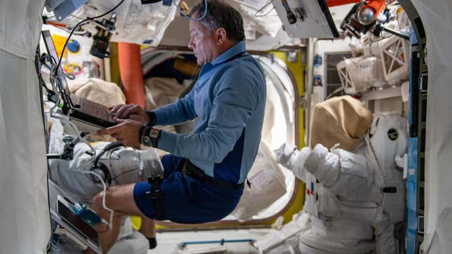 Ax-1 Commander Michael López-Alegría logging data for a research project conducted during the Ax-1 mission on the International Space Station..