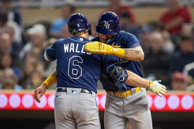 Sep 11, 2023; Minneapolis, Minnesota, USA; Tampa Bay Rays shortstop Taylor Walls (6) celebrates with center fielder Jose Siri (22) after hitting a three run home run against the Minnesota Twins in the fifth inning at Target Field.