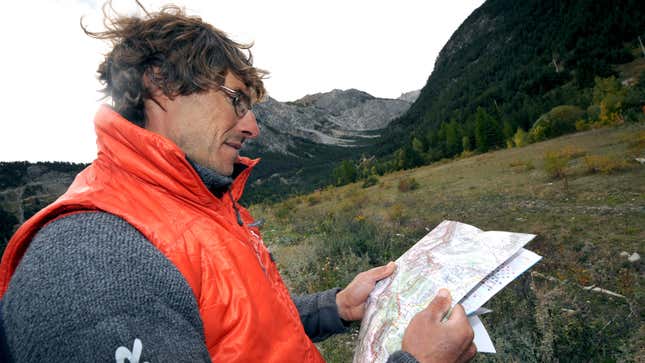 A photo of someone reading a map. 