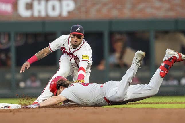Sep 6, 2023; Cumberland, Georgia, USA; Atlanta Braves shortstop Orlando Arcia (11) tags out St. Louis Cardinals designated hitter Alec Burleson (41) at second base during the first inning at Truist Park.