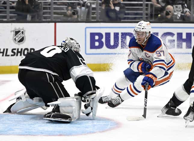 Apr 21, 2023; Los Angeles, California, USA; Los Angeles Kings goaltender Joonas Korpisalo (70) blocks a shot on goal by Edmonton Oilers center Connor McDavid (97) in the first period of game three of the first round of the 2023 Stanley Cup Playoffs at Crypto.com Arena.