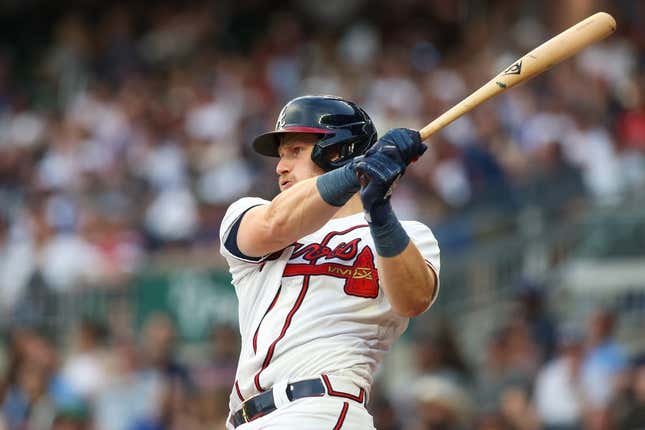 May 9, 2023; Atlanta, Georgia, USA; Atlanta Braves catcher Sean Murphy (12) hits a RBI single against the Boston Red Sox in the second inning at Truist Park.