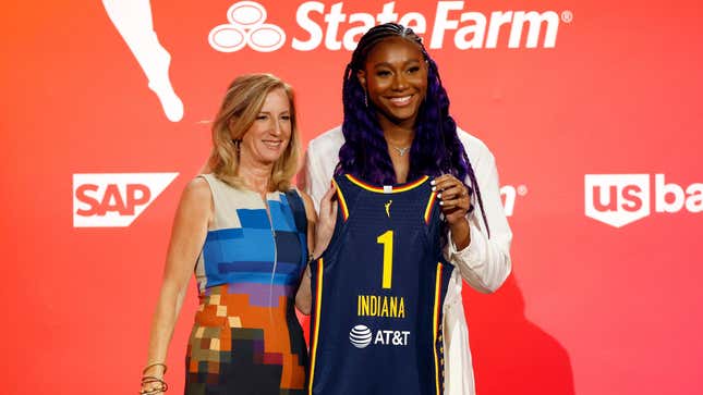 WNBA Commissioner Cathy Engelbert and Aliyah Boston pose for photos after Boston was drafted 1st overall by the Indiana Fever during the 2023 WNBA Draft at Spring Studios Monday night.