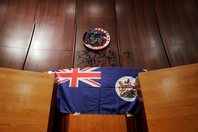 The colonial flag of Hong Kong is displayed inside a chamber after protesters broke into the Legislative Council building during the anniversary of Hong Kong’s handover to China on July 1, 2019.