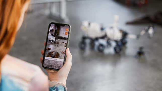 A child using the Technic AR mobile app to explored the real-life capabilities of the Mars Rover Perseverance.