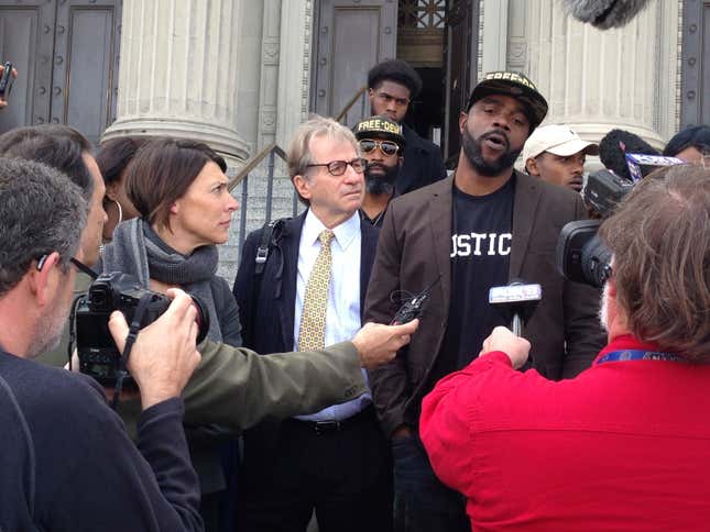 In this Jan. 26, 2017, file photo, Robert Jones, right, speaks with reporters, with defense attorneys Emily Maw, left, and Barry Scheck, at the New Orleans courthouse. Local prosecutors have reached a $2 million settlement with the New Orleans man who spent 23 years in prison before being cleared on charges that included rape and manslaughter. District Attorney Jason Williams said he reached the settlement Tuesday, Aug. 17, 2021 with Robert Jones, who was formally cleared of the charges on his 44th birthday in 2017. 