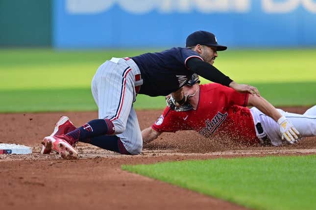 Sep 5, 2023; Cleveland, Ohio, USA; Cleveland Guardians center fielder Myles Straw (7) is caught stealing by Minnesota Twins shortstop Carlos Correa (4) during the third inning at Progressive Field.