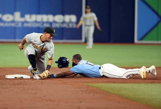 May 2, 2023; St. Petersburg, Florida, USA; Tampa Bay Rays center fielder Manuel Margot (13) slides safe into second base as Pittsburgh Pirates second baseman Mark Mathias (6) attempts to tag him out during the third inning at Tropicana Field.