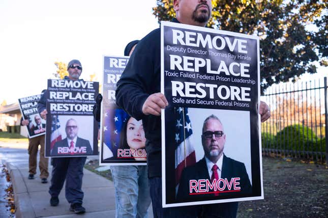 Federal correctional officers protest in response to an Associated Press investigation that exposed how the Bureau of Prisons repeatedly promoted Thomas Ray Hinkle who was accused of beating several Black inmates, in front of the Bureau of Prisons’ regional office, Monday, Dec. 12, 2022, in Stockton, Calif. 