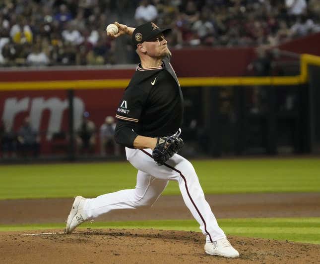 Arizona Diamondbacks relief pitcher Anthony Mickiewicz (36) throws against the San Diego Padres during the second inning at Chase Field on April 23, 2023.  mlb padres on d back