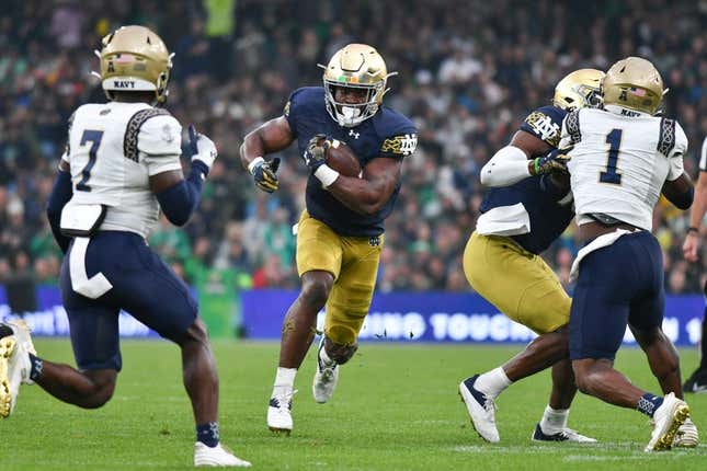 Aug 26, 2023; Dublin, IRL; Notre Dame Fighting Irish running back Audric Estime (7) runs the ball in the first quarter against the Navy Midshipmen at Aviva Stadium.