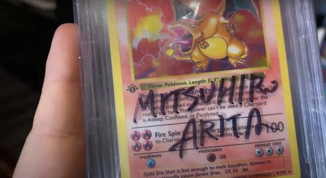 A signed pristine Charizard card, featuring original Pokémon artist Mitsuhiro Arita.