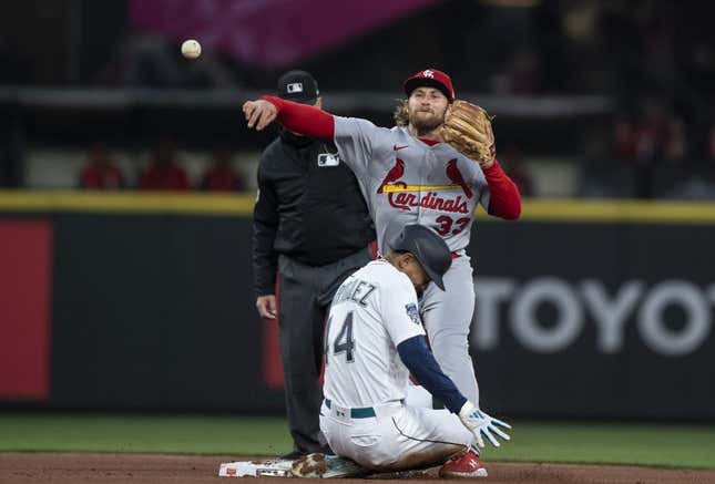 Apr 21, 2023; Seattle, Washington, USA; St. Louis Cardinals second baseman Brendan Donovan (33) turns a double play after forcing out Seattle Mariners centerfielder Julio Rodriguez (44) at second base during the third inning at T-Mobile Park.
