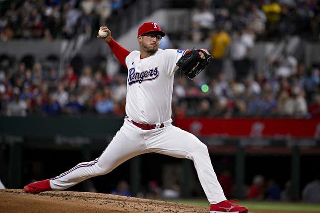 May 16, 2023; Arlington, Texas, USA; Texas Rangers starting pitcher Dane Dunning (33) pitches against the Atlanta Braves during the third inning at Globe Life Field.