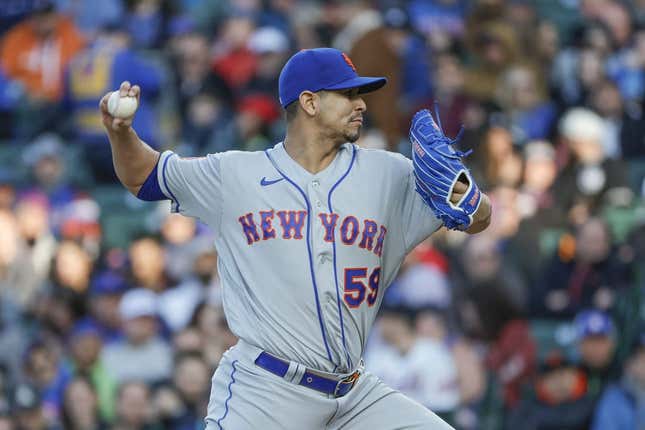 May 25, 2023; Chicago, Illinois, USA; New York Mets starting pitcher Carlos Carrasco (59) pitches against the Chicago Cubs during the first inning at Wrigley Field.