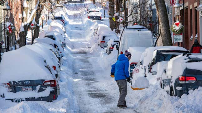 A person shoveling snow in Boston