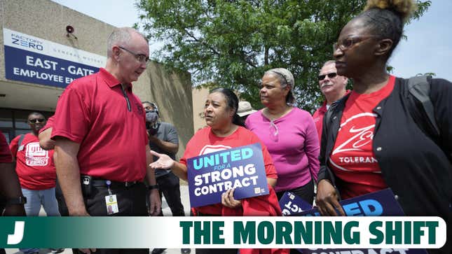 United Auto Workers president Shawn Fain, left, talks with autoworkers outside the General Motors Factory Zero plant in Hamtramck, Mich., on Wednesday, July 12.