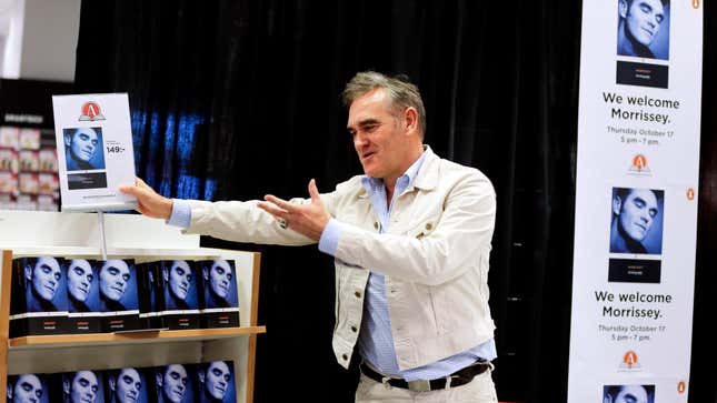 Morrissey showing off his book about Morrisey
