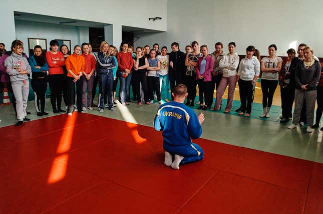 Prospective female police recruits lining up for strength and endurance exams at the Kyiv Police Academy.