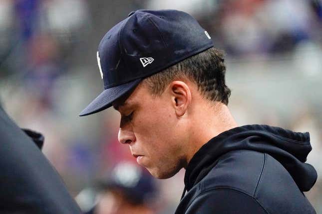 Apr 28, 2023; Arlington, Texas, USA; New York Yankees center fielder Aaron Judge (99) sits in the dugout during during the eighth inning against the Texas Rangers at Globe Life Field.