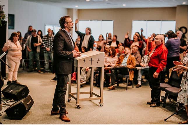 Pastor Brad Hill preaches at the Grace Downtown of Winchester church that he founded to help the Winchester community deal with addiction.