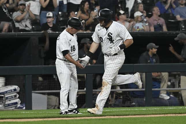 Jul 7, 2023; Chicago, Illinois, USA; Chicago White Sox third baseman Jake Burger (30) high fives Chicago White Sox third base coach Eddie Rodriguez (18)  after he hits a home run against the St. Louis Cardinals during the fifth inning at Guaranteed Rate Field.