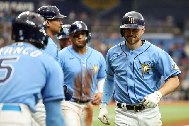 Apr 9, 2023; St. Petersburg, Florida, USA;  Tampa Bay Rays second baseman Brandon Lowe (8) celebrates after hitting a grand slam against the Oakland Athletics in the fourth inning at Tropicana Field.