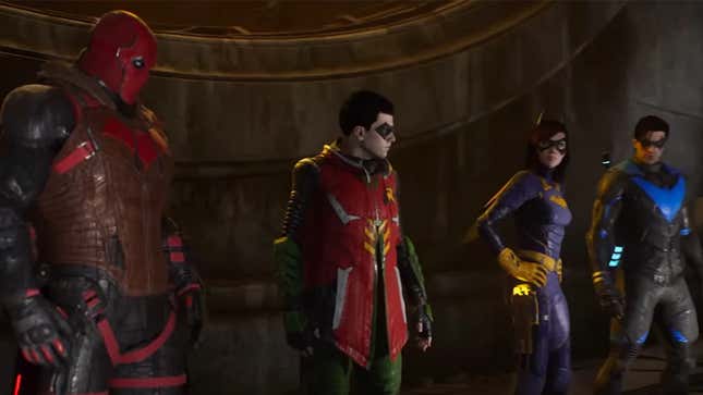 Video game versions of Red Hood, Robin, Batgirl, and Nightwing stand together as they watch over Gotham City in Gotham Knights.