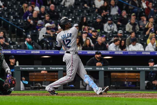 May 24, 2023;  Denver, Colorado, USA;  Miami Marlins right fielder Jorge Soler (12) hits a home run against the Colorado Rockies at Coors Field.