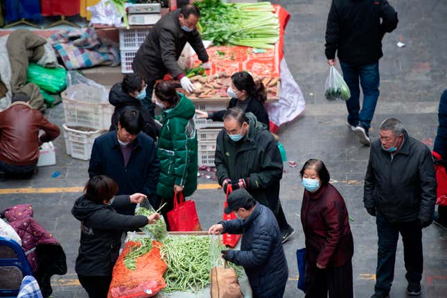 Citizens buy vegetables and food in Kaihua Temple Market in Taiyuan City, north China’s Shanxi Province, December 7, 2022.