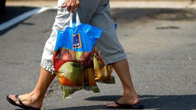 Person walking with ALDI shopping bag