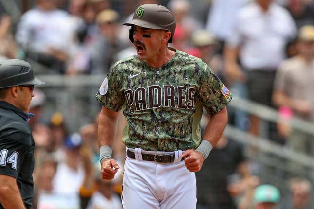 May 21, 2023; San Diego, California, USA; San Diego Padres designated hitter Matt Carpenter (14) celebrates after he scores during the first inning against the Boston Red Sox at Petco Park.