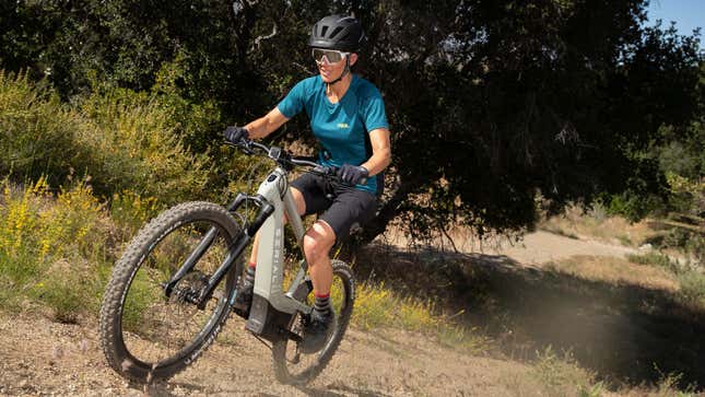 A photo of someone riding a Serial electric bike off-road. 