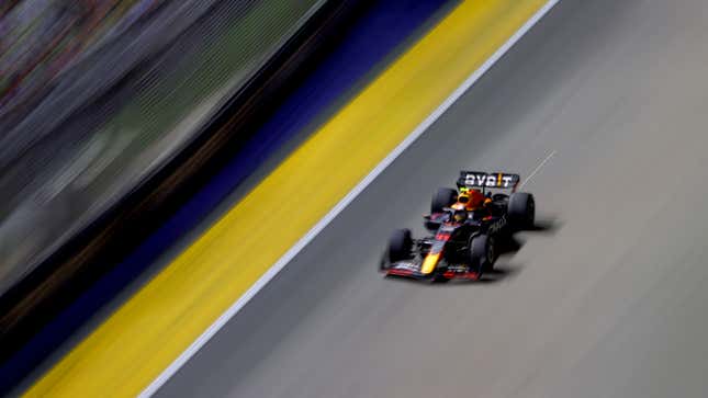 A photo of Sergio Perez racing his Red Bull F1 car in Singapore. 