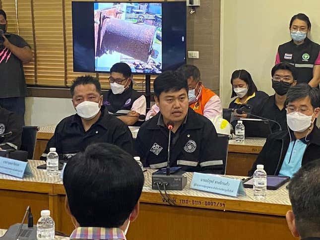 The missing cylinder is displayed at a meeting of Thai authorities involved in the search