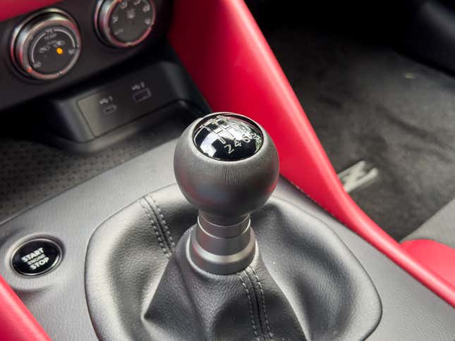 Manual shifter close-up image of red 2023 Nissan Z