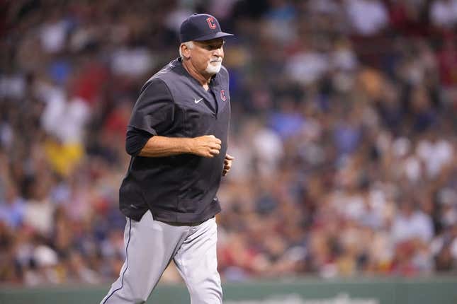 Jul 25, 2022; Boston, Massachusetts, USA; Cleveland Guardians pitching coach Carl Willis (51) returns to the dugout after making a mound visit during the fourth inning against the Boston Red Sox at Fenway Park.