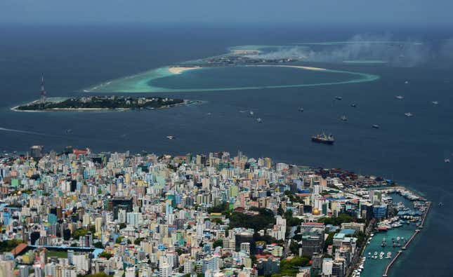 In this 2013 photo, smoke from Thilafushi can be seen near the capital city of Male.