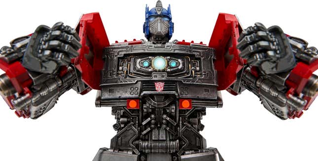 A low-angle closeup of Robosen's new Transformers: Rise of the Beasts Optimus Prime robot toy with the Matrix of Leadership revealed inside its chest.