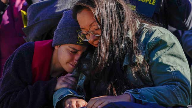 Youth Climate Activists Abby Leedy and Julie Paramo, who are both on a hunger strike, embrace at an action on October 27, 2021 in Washington, DC.