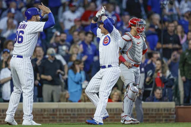 May 10, 2023; Chicago, Illinois, USA; Chicago Cubs catcher Yan Gomes (15) celebrates with first baseman Trey Mancini (36) after hitting a two-run home run against the St. Louis Cardinals during the fourth inning at Wrigley Field.