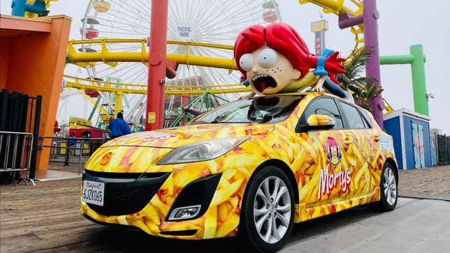 Rick and Morty's promotional Morty’smobile is covered in French fries with a screaming Wendy-Morty hybrid on top.