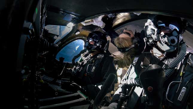 At apogee, pilots Dave Mackay and Michael Masucci sit in front, while astronaut trainer Beth Moses floats behind them.