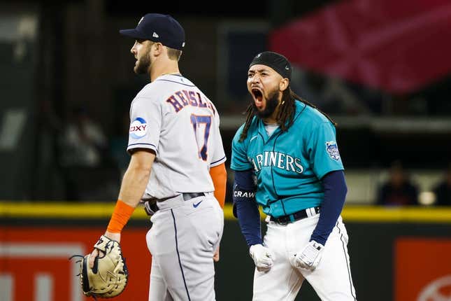 May 6, 2023; Seattle, Washington, USA; Seattle Mariners shortstop J.P. Crawford (3) reacts after hitting a three-run double against the Houston Astros during the eighth inning at T-Mobile Park. Houston Astros first baseman David Hensley (17) stands at left.